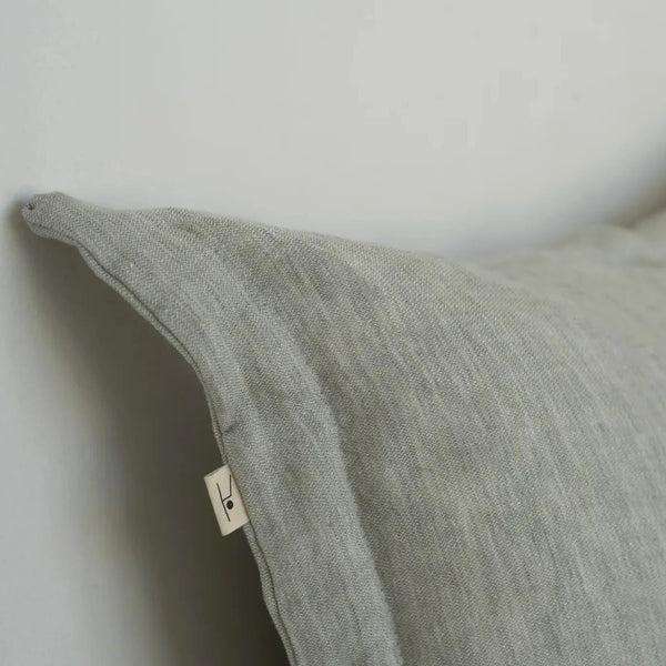 Marlene linen cushion cover styled on bed Barcelona design
